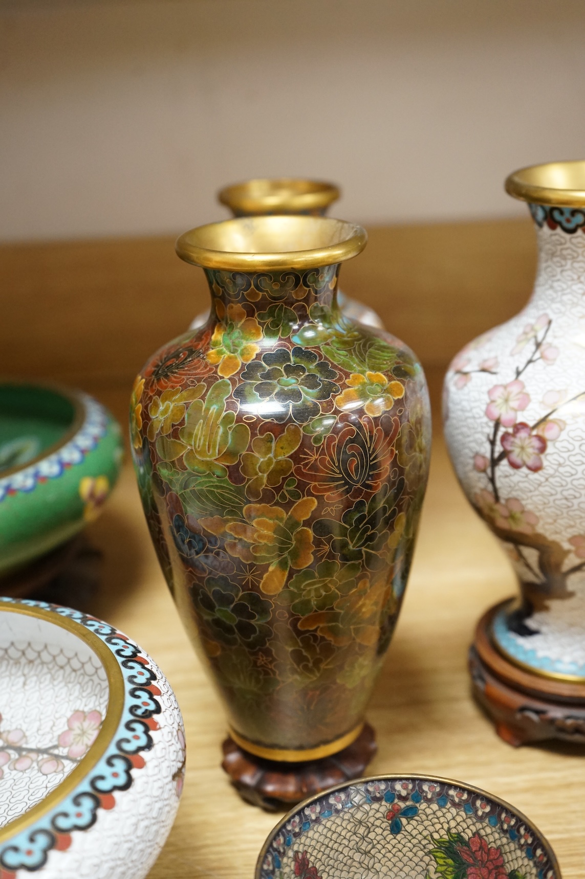 A plique a jour enamel tea bowl together with a collection of cloisonné enamel vases, bowls etc., tallest 26cm